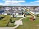 Community aerial view featuring a play area, gazebo, and walking paths at 558 Pawnee Ct, Haines City, FL 33844