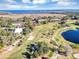 Community overview with golf course and waterfront views at 706 Santa Cruz Ln # 706, Howey In The Hills, FL 34737