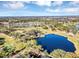 Aerial view showing expansive golf course and water features at 706 Santa Cruz Ln, Howey In The Hills, FL 34737