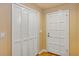 Inviting entryway with built-in storage and a classic white door at 706 Santa Cruz Ln # 706, Howey In The Hills, FL 34737