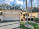 Spanish style home with landscaped grounds at 706 Santa Cruz Ln, Howey In The Hills, FL 34737