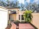 Inviting front entry with tiled walkway and landscaping at 706 Santa Cruz Ln # 706, Howey In The Hills, FL 34737