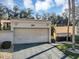 Attached garage with driveway, offering convenient parking at 706 Santa Cruz Ln, Howey In The Hills, FL 34737