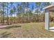 The yard backs up to a dense woodland at 7542 Sw 128 Terrace Rd, Dunnellon, FL 34432
