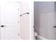 Image shows a toilet room with a door to a larger bathroom at 7542 Sw 128 Terrace Rd, Dunnellon, FL 34432