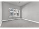 Bright bedroom with large window offering natural light and city views at 7770 Sandy Ridge Dr # 240, Kissimmee, FL 34747