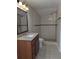 Bathroom with shower, vanity, and granite countertop at 800 Lake Marion Dr, Altamonte Springs, FL 32701