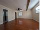 Bright bedroom featuring hardwood floors and ceiling fan at 800 Lake Marion Dr, Altamonte Springs, FL 32701