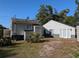 Guest house and workshop with white siding and double doors at 800 Lake Marion Dr, Altamonte Springs, FL 32701