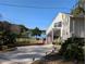 Mid-century modern home with lake view and brick walkway at 800 Lake Marion Dr, Altamonte Springs, FL 32701