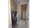 Laundry room with washer, dryer, and storage cabinets at 800 Lake Marion Dr, Altamonte Springs, FL 32701