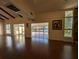 Living room with hardwood floors and views of the lake through sunroom at 800 Lake Marion Dr, Altamonte Springs, FL 32701