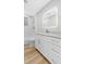 Modern bathroom with white vanity, marble countertop, and a shower/tub combo at 806 Palmer St, Orlando, FL 32801