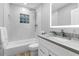 Modern bathroom with white vanity, shower, and hexagon tile floor at 806 Palmer St, Orlando, FL 32801