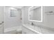 Modern bathroom with white vanity, marble countertop, and a walk-in shower at 806 Palmer St, Orlando, FL 32801