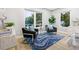 Bedroom with sitting area and stylish blue rug at 806 Palmer St, Orlando, FL 32801