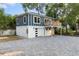 Modern home exterior with a detached garage and a paver driveway at 806 Palmer St, Orlando, FL 32801