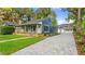 Renovated home with blue siding, gray pavers, and a spacious yard at 806 Palmer St, Orlando, FL 32801