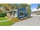 Newly built home with blue siding and a large driveway at 806 Palmer St, Orlando, FL 32801