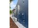 Rear exterior view showcasing the home's blue siding, AC units, and electrical panel at 806 Palmer St, Orlando, FL 32801