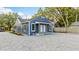 Charming blue house with a paved courtyard and landscaping at 806 Palmer St, Orlando, FL 32801