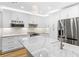 Modern kitchen featuring white cabinets and marble countertops at 806 Palmer St, Orlando, FL 32801