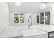 Modern kitchen with white cabinets and a large island at 806 Palmer St, Orlando, FL 32801