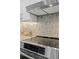 Stainless steel range and hexagon tile backsplash in modern kitchen at 806 Palmer St, Orlando, FL 32801