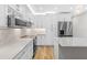 Modern kitchen with white shaker cabinets and a marble island at 806 Palmer St, Orlando, FL 32801