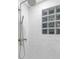 Clean and modern shower with glass block window and updated fixtures at 806 Palmer St, Orlando, FL 32801