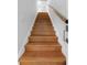 Clean and modern wooden staircase with metal railing at 806 Palmer St, Orlando, FL 32801