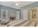 Bedroom with ensuite bathroom and access to a balcony at 8749 Via Tavoleria Way, Windermere, FL 34786