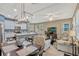 Open dining area with chandelier and seating for four at 8749 Via Tavoleria Way, Windermere, FL 34786