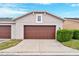 Attached garage with brown door and window at 8749 Via Tavoleria Way, Windermere, FL 34786