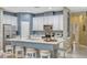 Modern kitchen with white cabinets, stainless steel appliances, and an island at 8749 Via Tavoleria Way, Windermere, FL 34786