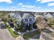 Two-story house with a gray exterior, two-car garage, and a landscaped yard at 8758 Pinter St, Orlando, FL 32827