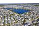 Aerial view of community with lake at 8758 Pinter St, Orlando, FL 32827