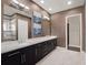 Modern bathroom with double vanity and marble countertop at 8758 Pinter St, Orlando, FL 32827