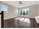 Spacious bonus room featuring hardwood floors and abundant natural light at 8758 Pinter St, Orlando, FL 32827