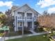 Two-story gray house with white trim, a balcony, and a landscaped front yard at 8758 Pinter St, Orlando, FL 32827