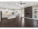 Open living area showcasing hardwood floors and a stylish built-in entertainment center at 8758 Pinter St, Orlando, FL 32827