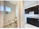 Convenient half bathroom next to the laundry room at 9062 Sperry St, Orlando, FL 32827