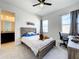 Cozy bedroom with built-in desk and en-suite bathroom at 9062 Sperry St, Orlando, FL 32827