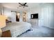 Spacious bedroom with large windows and en-suite bathroom at 9062 Sperry St, Orlando, FL 32827