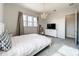 Bedroom with white bed frame and dresser, plus TV at 9062 Sperry St, Orlando, FL 32827