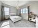 Well-lit bedroom with white bed frame and chandelier at 9062 Sperry St, Orlando, FL 32827