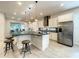 Modern kitchen with a large island, stainless steel appliances, and granite countertops at 9062 Sperry St, Orlando, FL 32827