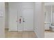 Hallway with doors to bedrooms and bathroom, fire extinguisher present at 911 N Orange Ave # 214, Orlando, FL 32801