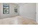 Well lit bedroom with tile floors and two windows at 911 N Orange Ave # 214, Orlando, FL 32801