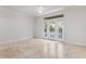 Spacious living room with tile floors and access to a balcony at 911 N Orange Ave # 214, Orlando, FL 32801